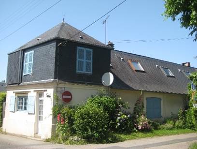 A house with a blue shuttered roof

Description automatically generated