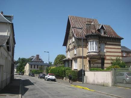 A house on the street

Description automatically generated