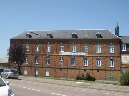 Long shot of a brick building

Description automatically generated